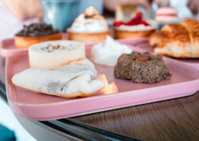 A selection of delicious pastries presented on a chic pink tray, perfect for brunch.